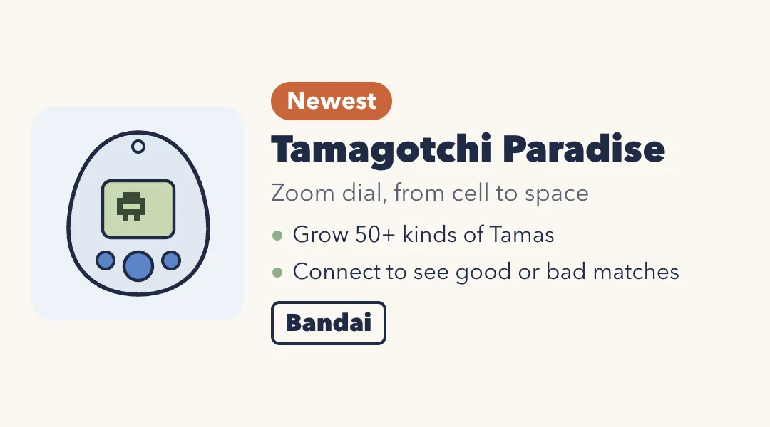 Drawing of an egg-shaped virtual pet with a light shell and a blue center dial. Tamagotchi Paradise: zoom dial from cell to space; grow 50 plus kinds of Tamas; connect to see good or bad matches. Bandai.