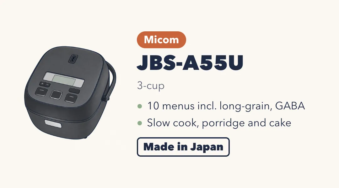 Drawing of the Tiger JBS-A55U, a compact square matte black rice cooker with a handle and a small display. Micom, 3-cup. 10 menus including long-grain and GABA; slow cook, porridge and cake. Made in Japan.